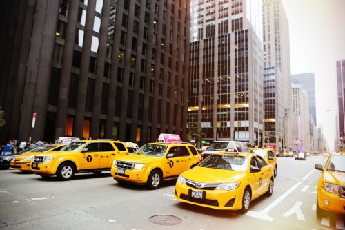 Taxis in a city street need paratransit insurance